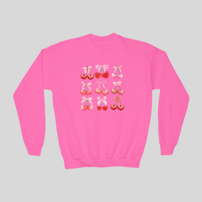 Image: Cherry Bow Girls Sweatshirt, available in Hot pink, White and dark gray. This coquette aesthetic shirt features 9 different cherries with bows, making a large soft girly graphic. Makes a great Valentines gift for toddlers and little girls, by jaecrece