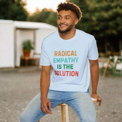 Image: Make a statement with this bold "Radical Empathy is the Solution" t-shirt, a must-have for activists and progressive thinkers. This unisex tee is perfect for rallies, protests, or everyday wear, ensuring your values are seen and heard. Whether you support mental health awareness, neurodiversity, or feminist causes, this inclusion shirt is a great way to share your message, by jaecrece.