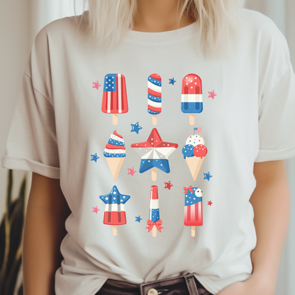 Image: Celebrate in comfort with this red white and blue patriotic popsicle shirt, designed for adults in inclusive sizes XS to 5XL. Great for Independence Day, Veterans Day, or Memorial Day events, this American themed tee brings a playful touch to any gathering. Pair with denim shorts or a skirt for a relaxed look perfect for summer barbecues or firework shows, by jaecrece.