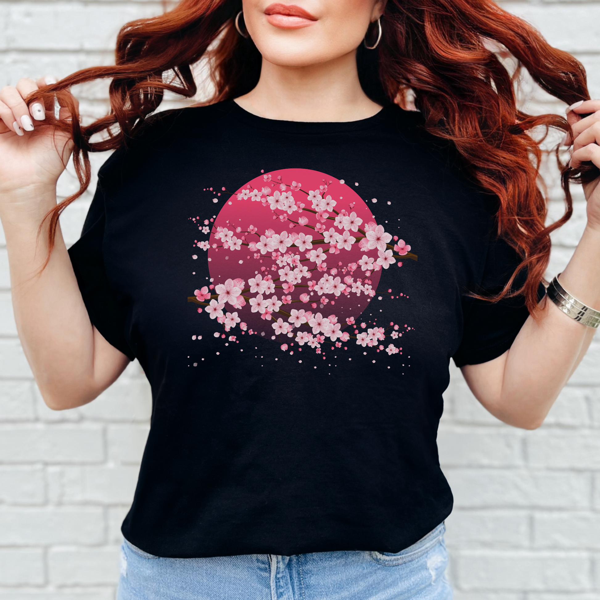 Image: A pink cherry blossom t-shirt featuring a delicate sakura tree design. The soft, durable fabric offers comfort, while the classic fit makes it versatile for any occasion. Perfect for springtime celebrations, Japanese aesthetic lovers, and those who appreciate kawaii fashion. Ideal as a gift for teens and adults. 