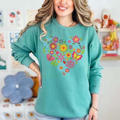 Image: Butterfly Heart Sweatshirt. This botanical pullover sweater is printed on a Comfort Colors©️ 1566 top, has a nature theme graphic of botanical flowers, honeybees, dragonflies, leaves. A romantic Valentine gift or Earth Day outfit, by jaecrece