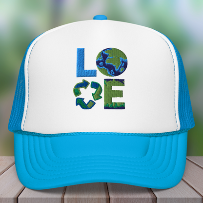 Image: Earth Day Foam Trucker Hat. This Save the Planet Unisex Hat has a teal blue bill and mesh back. The front of the baseball cap has LOVE embroidery to represent our planets oceans, plants and a commitment to reduce reuse and recycle, by jaecrece