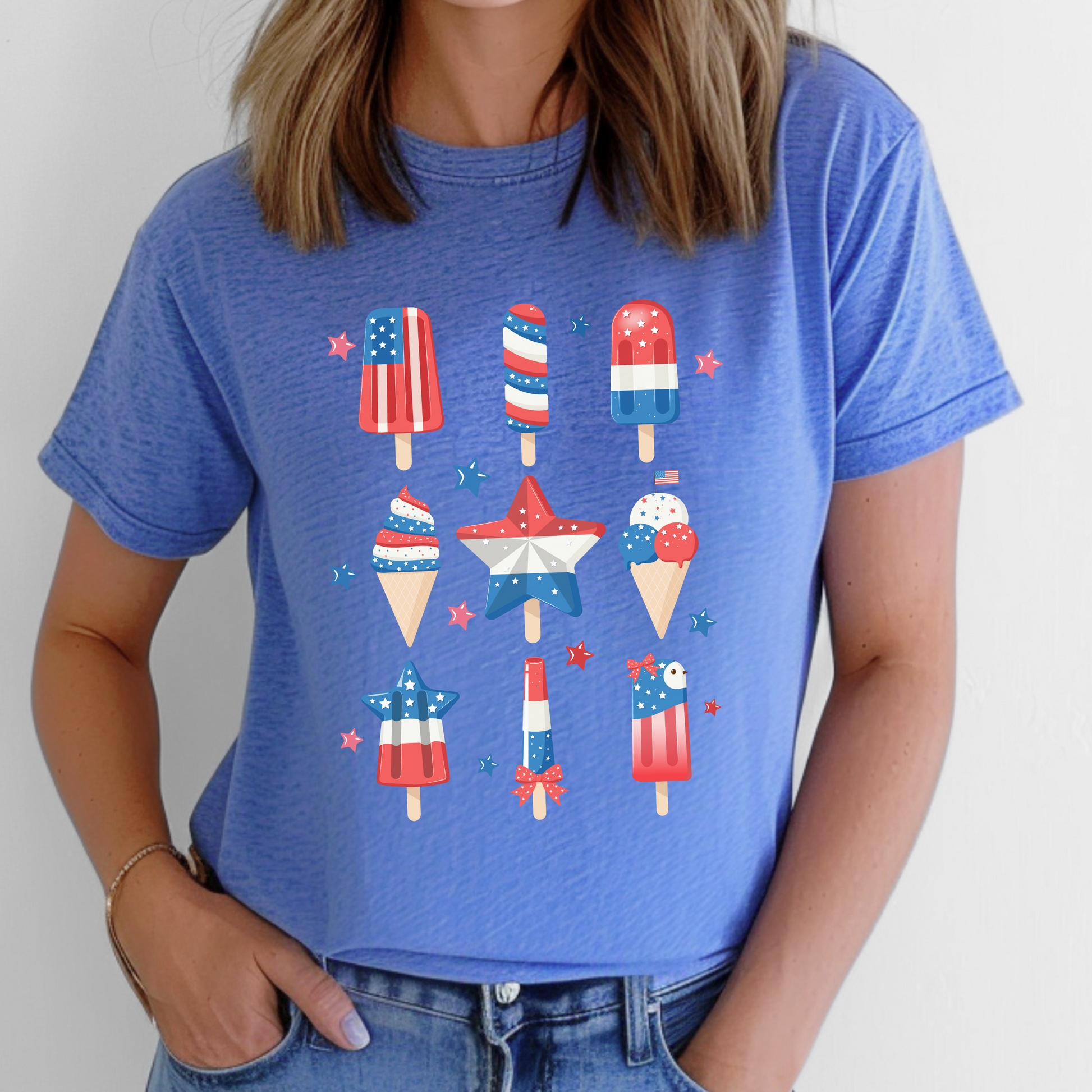 Image: Flaunt your patriotic side in this red white and blue popsicle tee, available in inclusive adult sizes from XS to 5XL. Perfect for celebrating the 4th of July, this comfy shirt works great for parades, cookouts, and summer beach parties. The cheerful frozen treat graphic adds personality, making it a great option for anyone who loves bold American themed fashion, by jaecrece.