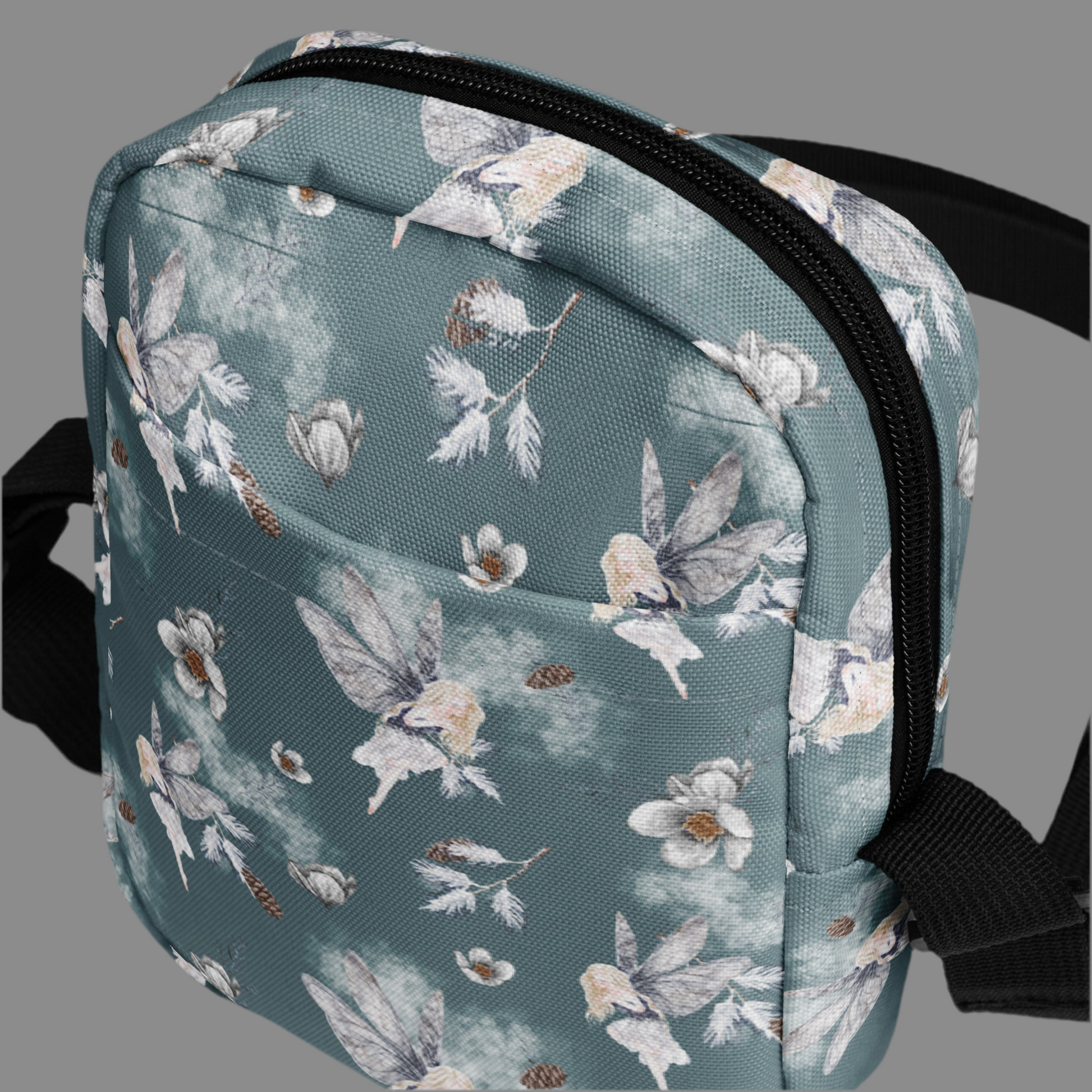 Grey small canvas crossbody utility bag, with a repeating fairy, floral and pinecone pattern. This hiking biking small tote can be worn on the hips, waist or cross the chest. The perfect gift or festival pouch for ladies, teens and tween. By jaecrece