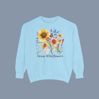 Bluebonnet floral sweatshirt celebrating wildflower season in Texas with a soft cotton fleece feel. Features a vintage-style graphic of spring blooms, perfect for the cottagecore girl or Southern mama. Designed with comfort in mind, this cozy pullover is perfect for layering on breezy days and capturing the spirit of Texas nature trails and wildflower festivals.