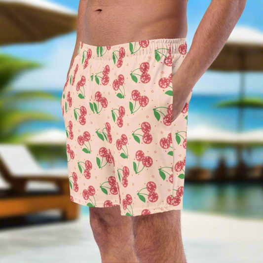 Image: Disco Cherries Mens Swim Trunks in sizes 2T-7, This fruit inspired swimsuit is a part of our Family Matching Swimwear Collection, and features a pink background with red disco ball cherries and stars, by jaecrece