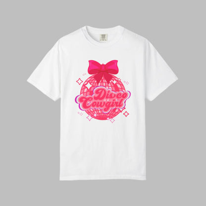 Comfort Colors Disco Cowgirl tee for women featuring bold pink script, sparkly disco ball, and hot pink bow for a festive coquette vibe. Great for rodeo season, girls' trips, and honky tonk nights. A retro-inspired western shirt made for comfort and fun in black, pepper, ivory, and white, S–4XL. Matching sweatshirt available for the full look.