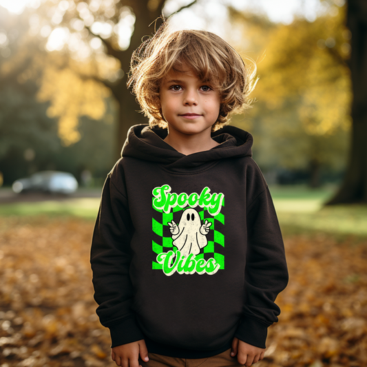 Spooky Vibes Halloween Toddler Hoodie. Featuring a green checkerboard design with a cute ghost giving peace signs, with the text spooky vibes. Mommy and Me/ Family Matching options, by jaecrece