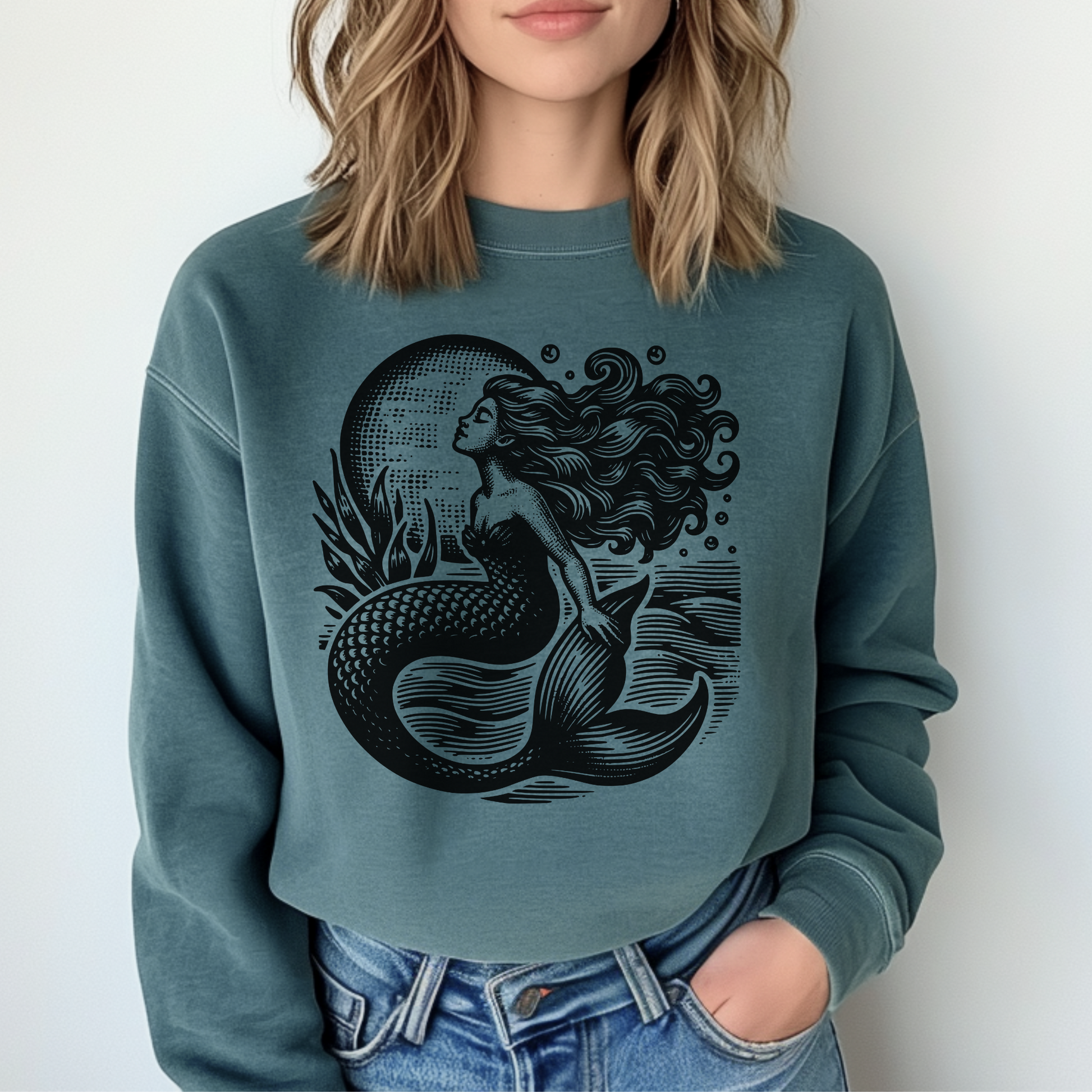 Image: Mermaid  Sweatshirt, Vintage Ocean Vibes Sweatshirt. Pullover crewneck features large black graphic with mermaid in front of the moon, in the ocean waves. Gift for women and teens who love a vintage ocean aesthetic and mermaidcore, by jaecrece