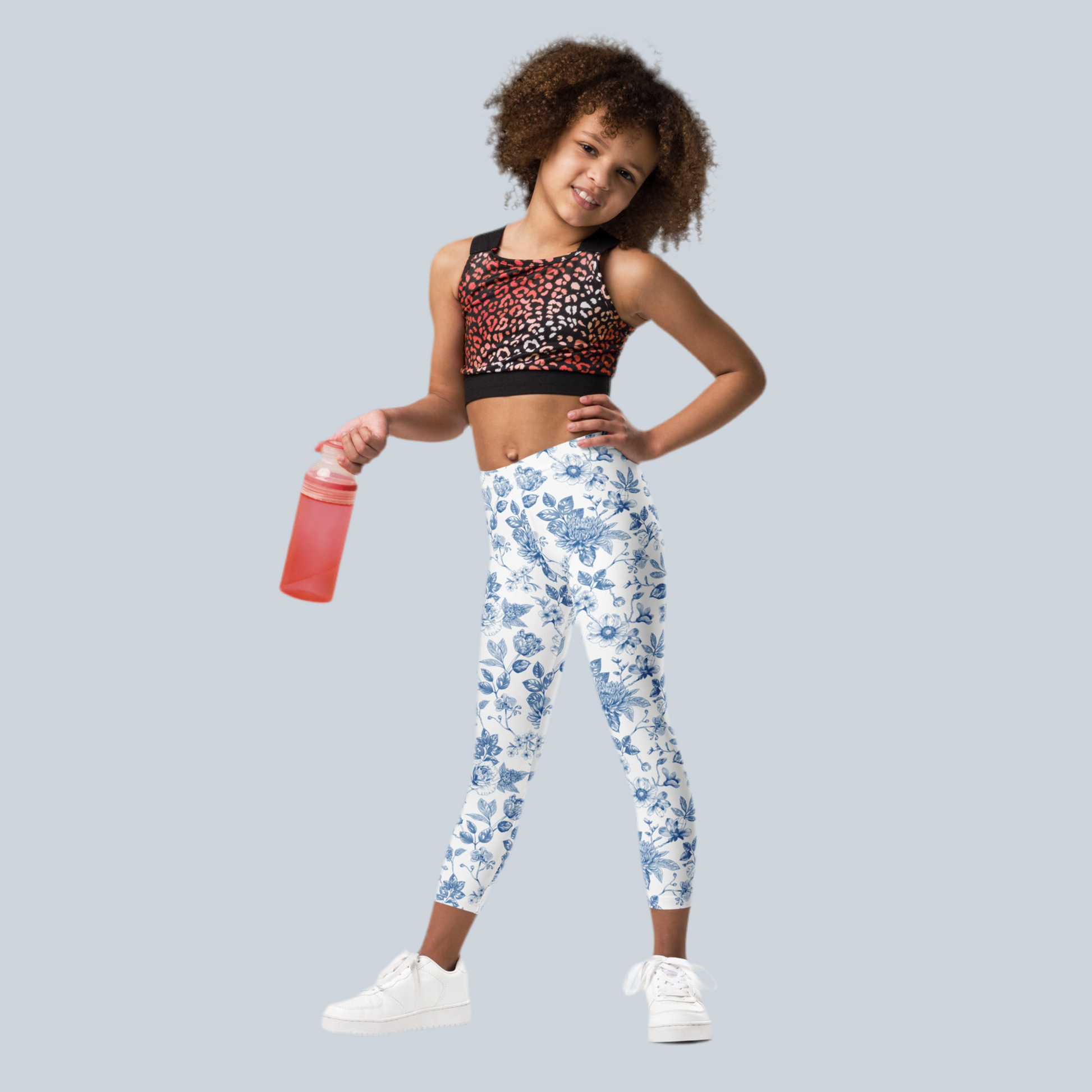 Image: Blue toile print leggings in toddler and little girl sizes, perfect for spring, Easter, birthdays, or casual weekends. Designed in sizes 2T to 7, these leggings are made from soft fabric that keeps kids comfortable while they play, explore, and pose for family portraits. A great choice for matching sibling looks or gifts, by jaecrece.
