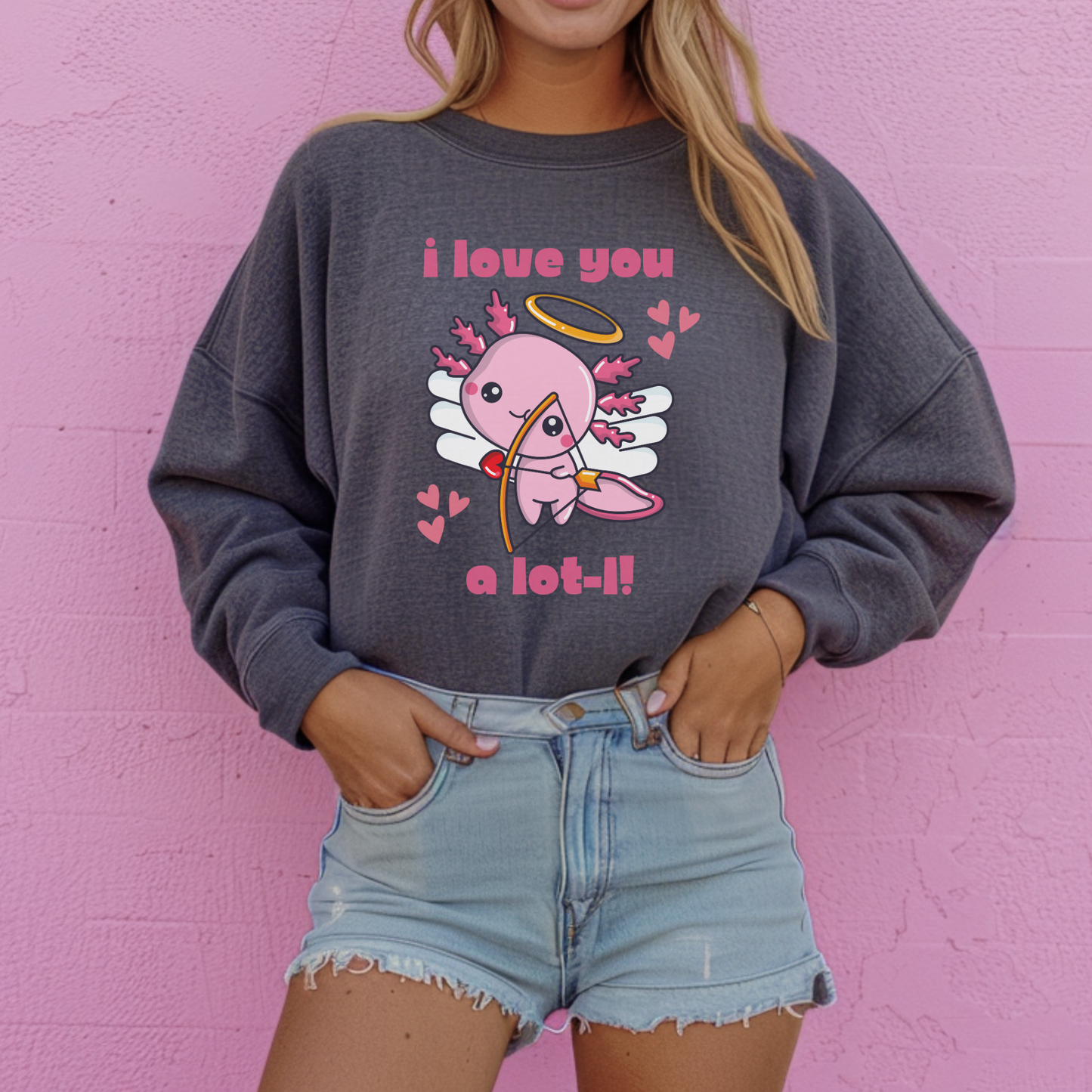 Adorable axolotl sweatshirt for Valentine’s Day featuring a sweet cupid inspired design and playful animal pun. Cozy crewneck pullover available in multiple colors and sizes, perfect for axolotl lovers, Valentine outfits, and casual everyday wear.