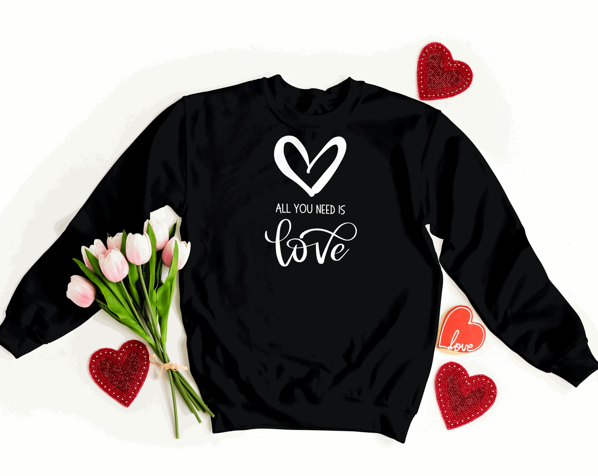 All You Need is Love Organic Sweatshirt. Image features a white heart, and the text "All You Need is Love"