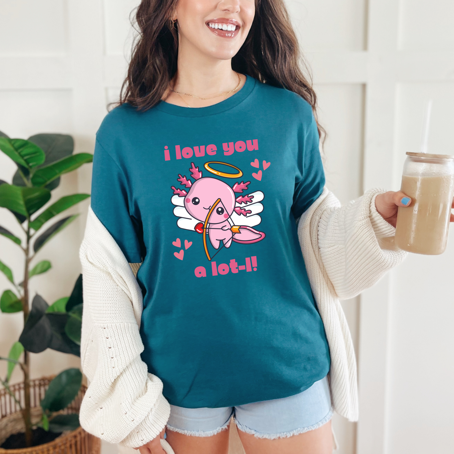 Deep Teal Bella Canvas 3001 tshirt with the I Love You A Lot L Axolotl Cupid design featuring a lovable axolotl cupid and heart accents. Soft unisex graphic tee in adult sizes XS to 5XL with child sizes available for matching family style. Rich teal color gives the playful design a bold standout look while staying easy to wear. Lightweight comfortable shirt for Valentine events, casual outings, school spirit days, travel, or gifting to fans of cute and funny animal shirts.
