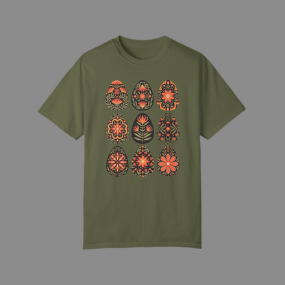 Image: This folk art Easter shirt features a vibrant floral and botanical Easter egg design with vintage Scandinavian influences. The intricate patterns reflect traditional Nordic craftsmanship, creating a timeless spring fashion statement. Perfect for casual outings or Easter festivities, this soft and stylish t-shirt brings together the beauty of cottagecore, boho aesthetics, and Swedish hygge in one charming piece, by jaecrece.