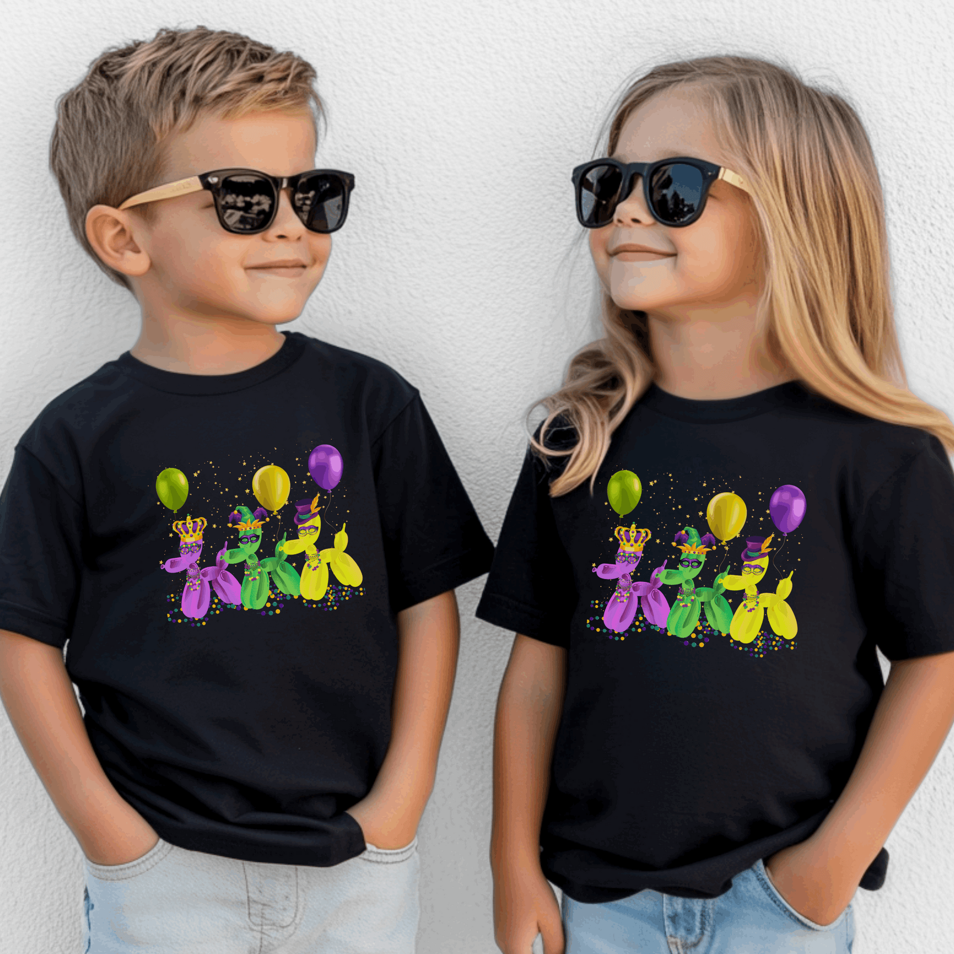 This Mardi Gras girls or boys t-shirt is perfect for New Orleans fun! It features three balloon dogs dressed in purple, green, and gold with beads and confetti—ideal for family matching during French Quarter parades. The "walk it like a dog" design adds a playful twist for kids who want to celebrate Mardi Gras in bold style. Soft, breathable, and festive—great for parade day or class parties.