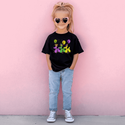 Celebrate Mardi Gras in New Orleans with this fun kids parade shirt! Featuring balloon dogs in gold, green, and purple with beads, confetti, and masks, this festive tee is perfect for walking the French Quarter or watching floats go by. Inspired by the “walk it like a dog” energy of Carnival season, it’s a standout piece in any family matching outfit for parties, parades, or school events.