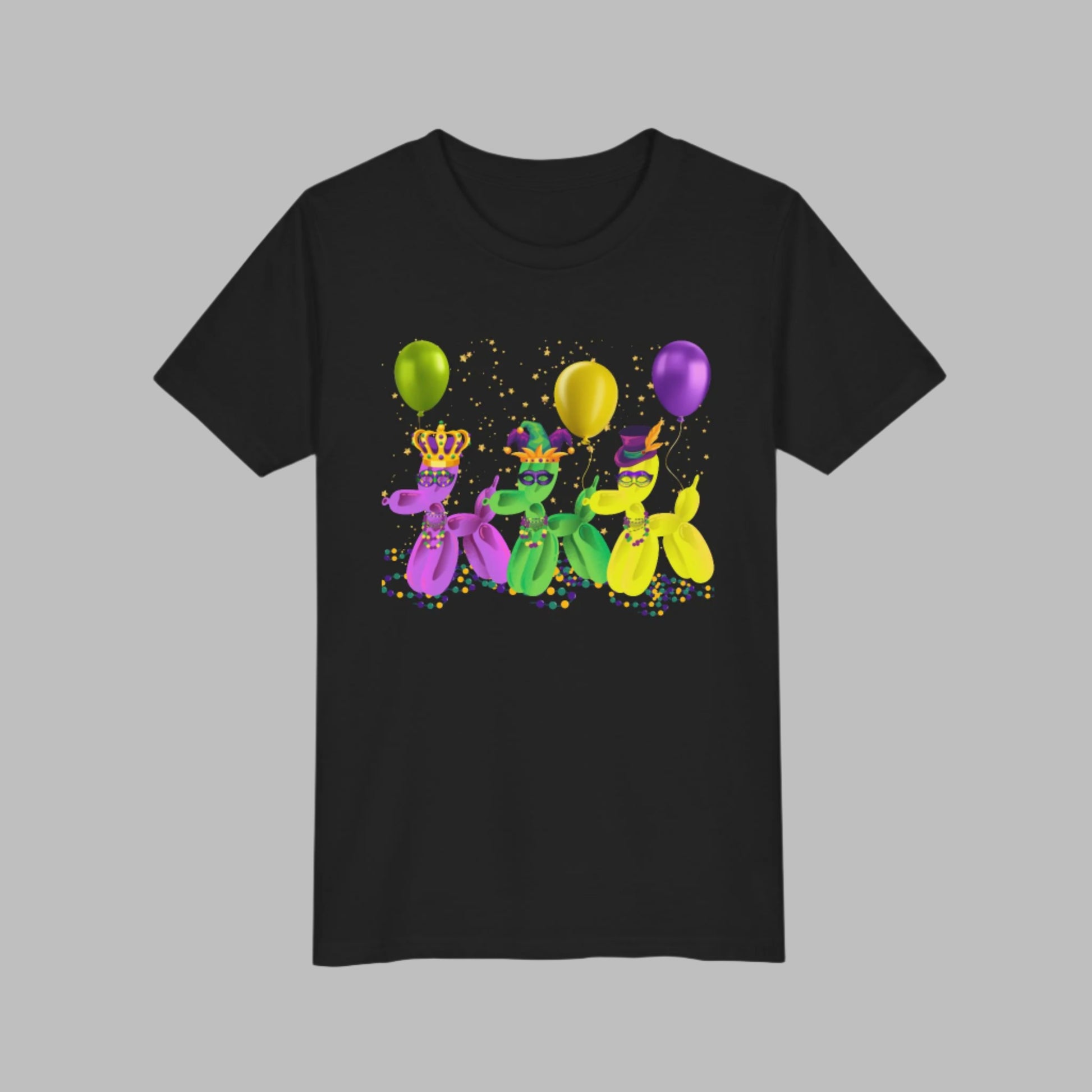 Image: Mardi Gras Balloon Dog Kids Tee Flatlay. Bold, playful, and parade-ready—this youth Mardi Gras t-shirt brings New Orleans fun to life with three balloon dogs in purple, green, and gold. With their Carnival masks, beads, and hats, these pups are ready to "walk it like a dog" through the French Quarter! Designed for family matching moments and festive fun, it's the perfect choice for any kid celebrating Mardi Gras in style.