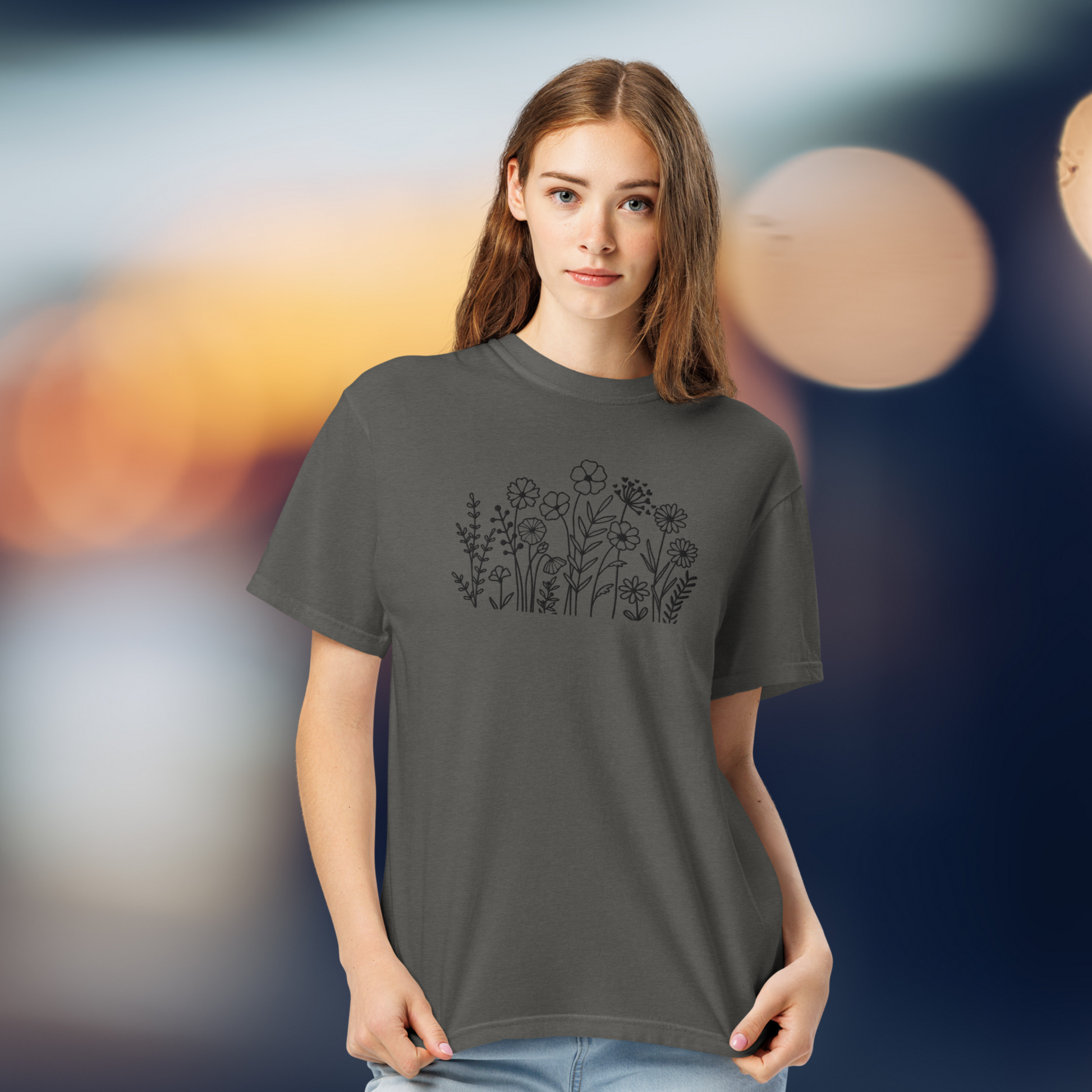 Image: A stylish dark grey crewneck shirt featuring black wildflower embroidery, blending a boho-chic aesthetic with classic casualwear. The floral pattern is stitched with precision, creating a subtle yet intricate nature-inspired motif. Whether paired with jeans or leggings, this embroidered sweater adds effortless charm to any wardrobe, making it an excellent gift for flower lovers and nature enthusiasts alike, by jaecrece.