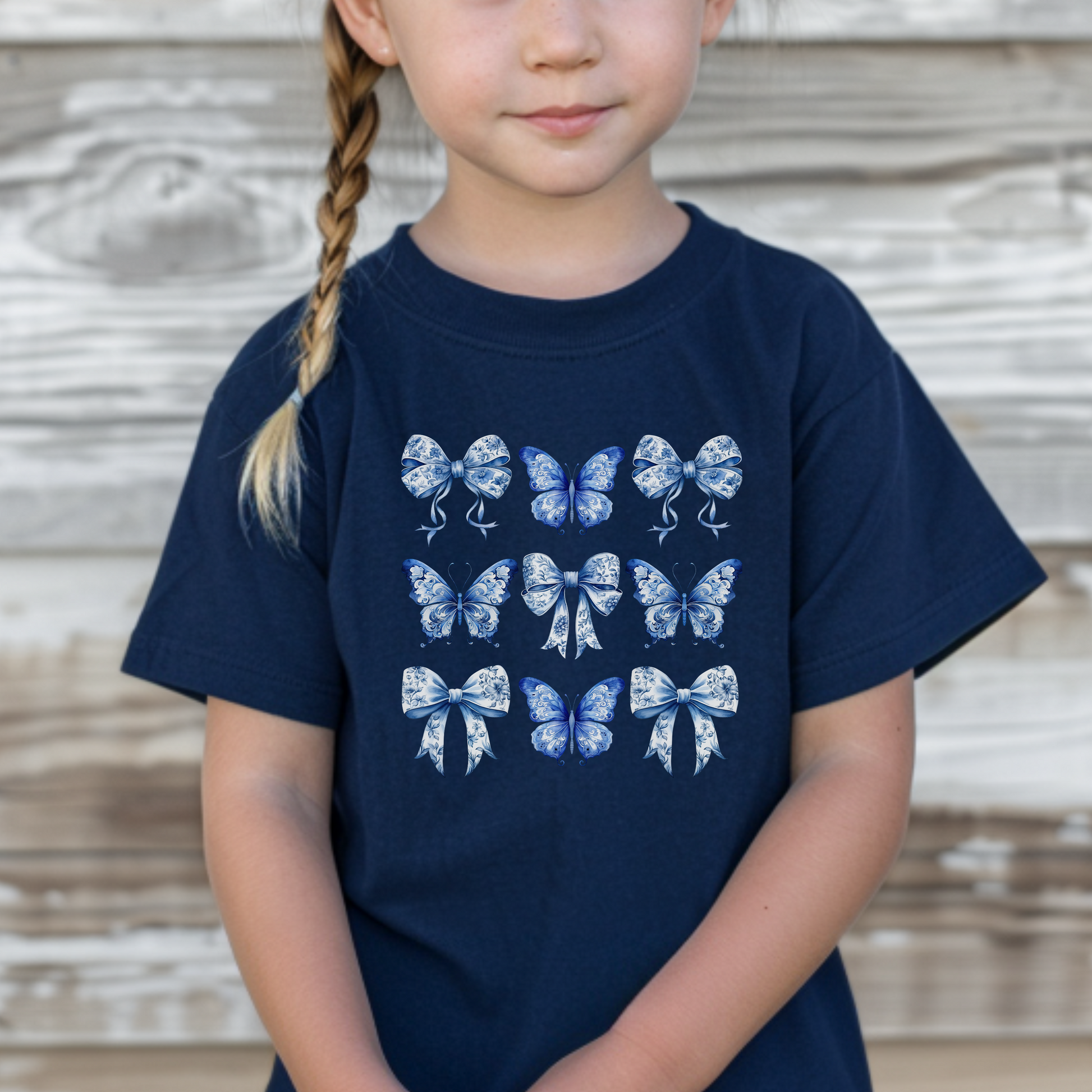 Blue Toile Bow Butterfly Toddler Shirt in Navy. This shirt features a pattern of 9 blue toile butterflies and bows in a square shape. Perfect for toile de juoy lovers. Also available in women and child sizes for family or mommy and me match outfits.