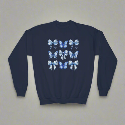 Blue Toile Girls Sweatshirt with delicate bow and butterfly details in a classic navy and white toile pattern. Sizes XS–XL fit girls and tweens comfortably. Soft and cozy, perfect for spring or fall layering, casual outfits, or family events. Embraces soft girl aesthetic, Texas coquette, coastal cowgirl, and whimsical cottagecore trends. Part of a matching family collection, ideal for sibling coordination or mom and daughter photo outfits. Makes a thoughtful birthday gift or stylish wardrobe staple for girl