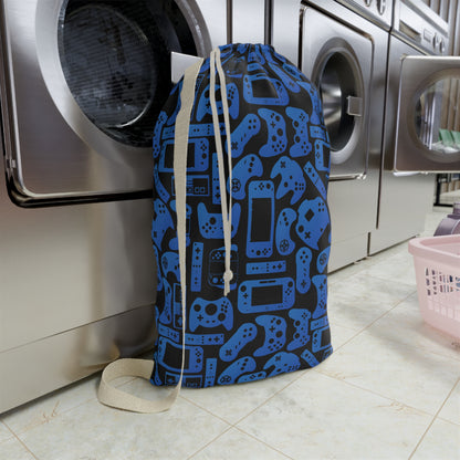 Blue and black video game laundry bag with a repeating pattern of controllers, handheld gaming systems, and console inspired details. Add a child’s name for a personalized touch. A fun and practical laundry storage bag for gamer kids, boys, girls, teens, camp, sleepovers, college, and travel.