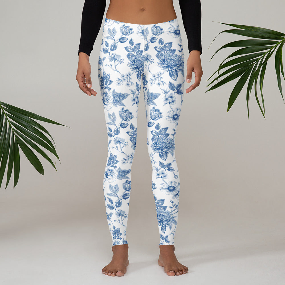 Image: Blue and white toile leggings for women, styled with a graceful floral pattern that brings vintage charm to your everyday wardrobe. With sizes ranging from XS to XL, these comfortable leggings are part of a matching family outfit set. Great for family photos, gifts for moms, or springtime events, these leggings offer the perfect mix of nostalgic design and modern comfort, by jaecrece.