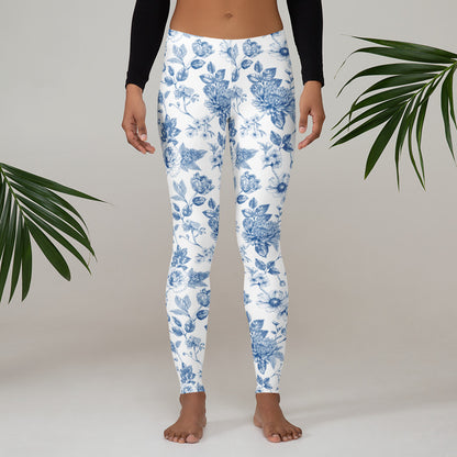 Image: Blue and white toile leggings for women, styled with a graceful floral pattern that brings vintage charm to your everyday wardrobe. With sizes ranging from XS to XL, these comfortable leggings are part of a matching family outfit set. Great for family photos, gifts for moms, or springtime events, these leggings offer the perfect mix of nostalgic design and modern comfort, by jaecrece.
