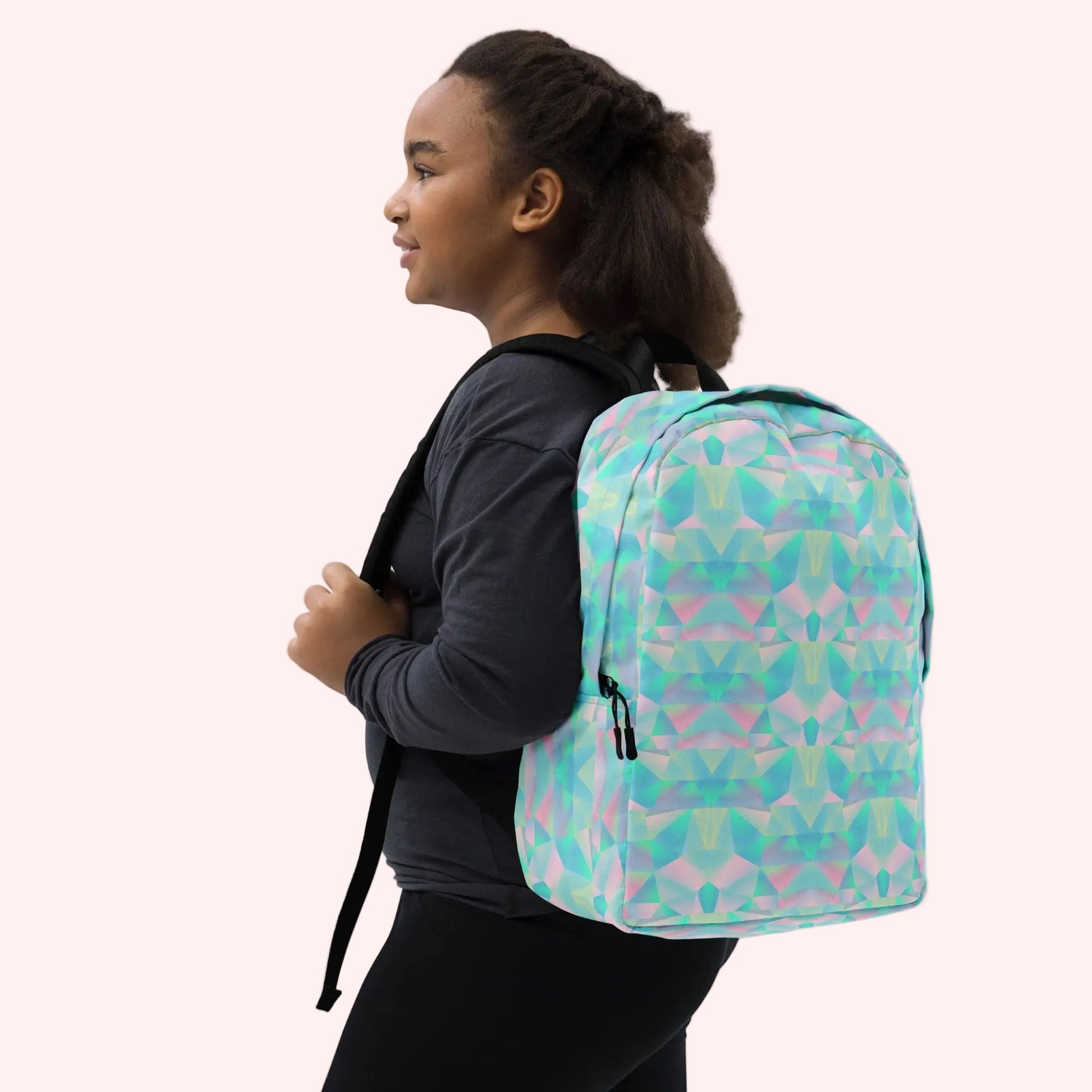 Person wearing a colorful geometric-patterned backpack on a white background