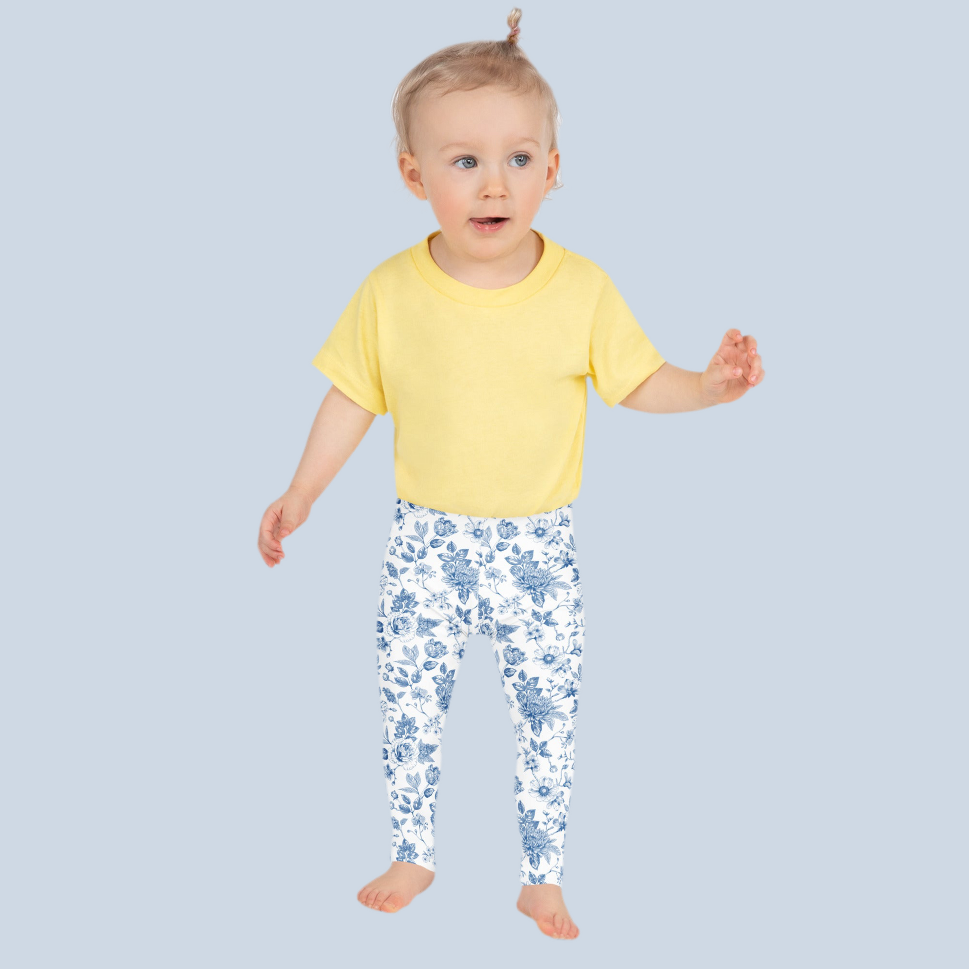 Image: Classic and cozy blue toile print leggings for toddler girls, made with ultra soft fabric for all-day play. This vintage French pattern makes a lovely statement for spring fashion, Easter outfits, or family portraits. Perfect for girls sizes 2T to 7, these leggings match with our women's and youth sets, bringing timeless charm to your family wardrobe, by jaecrece.