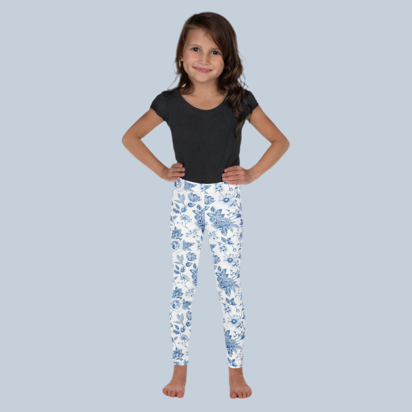 Image: Blue toile toddler girls leggings in vintage cottagecore style, perfect for dressing up or casual everyday wear. Sizes 2T to 7 available in a soft stretchy material ideal for preschool, weekend outings, or dressy moments. A charming gift for birthdays or Easter, and perfect for family matching photo sessions, by jaecrece.