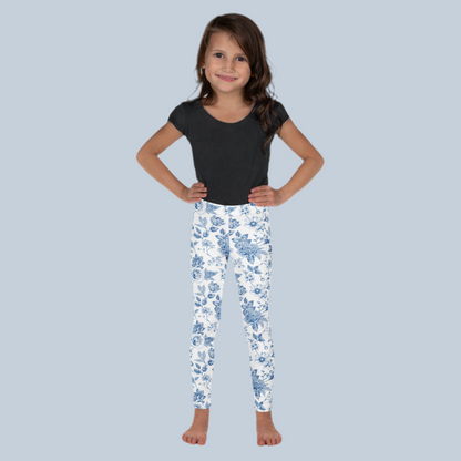 Image: Blue toile toddler girls leggings in vintage cottagecore style, perfect for dressing up or casual everyday wear. Sizes 2T to 7 available in a soft stretchy material ideal for preschool, weekend outings, or dressy moments. A charming gift for birthdays or Easter, and perfect for family matching photo sessions, by jaecrece.