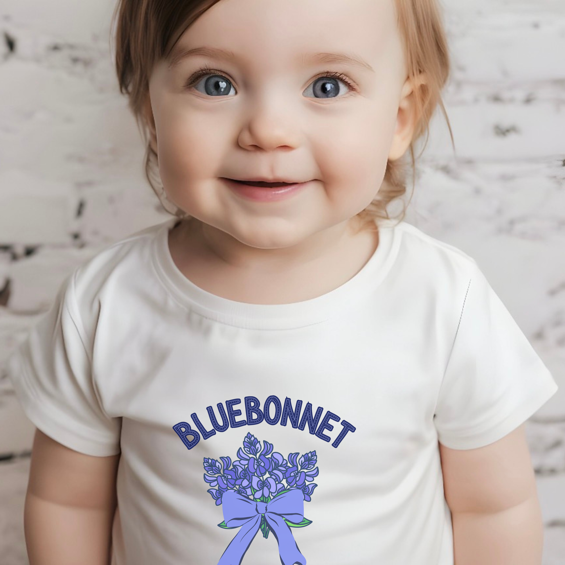 Bluebonnet baby shirt in Athletic Heather featuring a Texas wildflower design, shown as a comfortable infant Texas outfit for babies who love the Lone Star State, perfect for spring, outdoor adventures and everyday wear