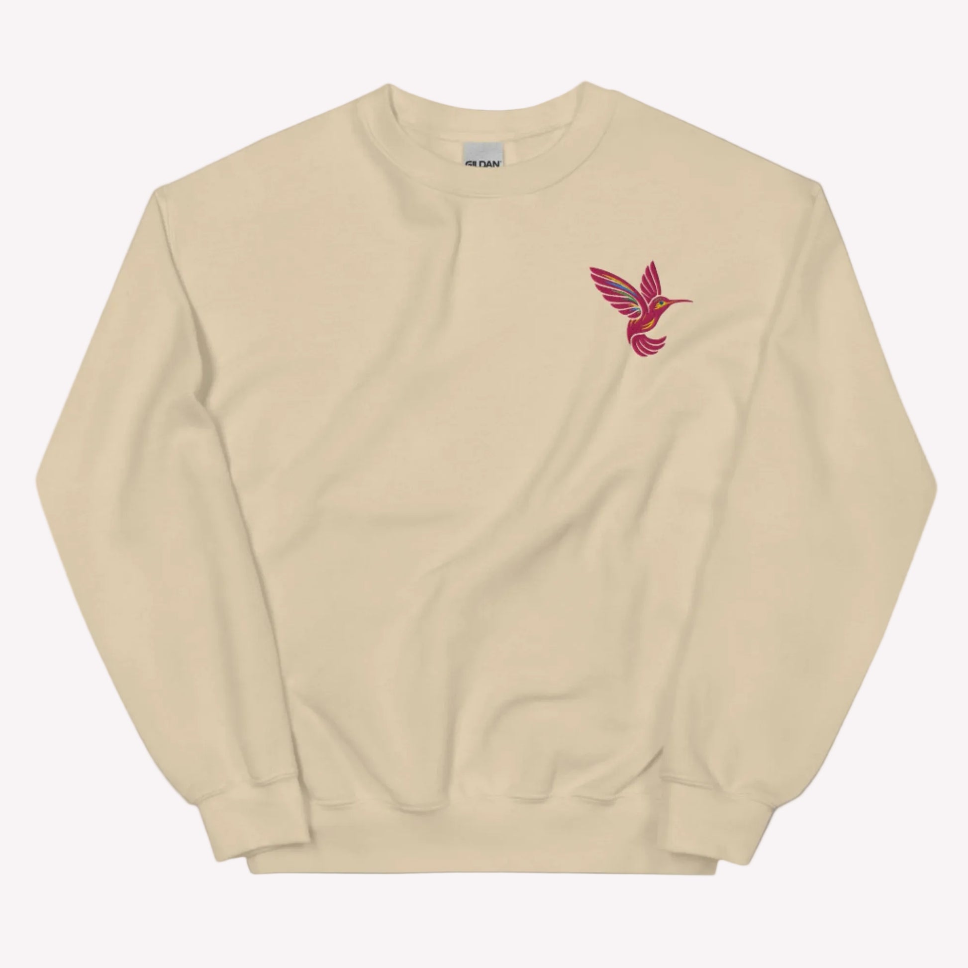Botanical hummingbird sweatshirt featuring embroidered bird design on soft Gildan 18000 crewneck pullover. Cozy unisex fit with cotton blend fabric for comfort and durability. Perfect for nature lovers, floral aesthetic outfits, and everyday casual style. Ideal for gifting to moms, friends, and bird enthusiasts. Available in extended sizing S to 5XL.