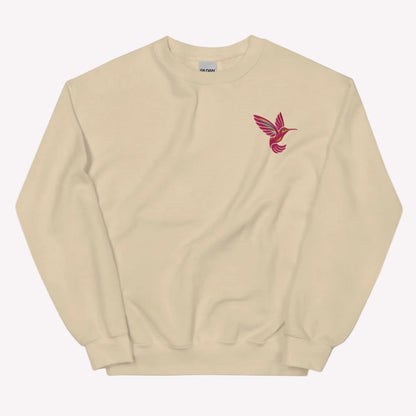 Botanical hummingbird sweatshirt featuring embroidered bird design on soft Gildan 18000 crewneck pullover. Cozy unisex fit with cotton blend fabric for comfort and durability. Perfect for nature lovers, floral aesthetic outfits, and everyday casual style. Ideal for gifting to moms, friends, and bird enthusiasts. Available in extended sizing S to 5XL.