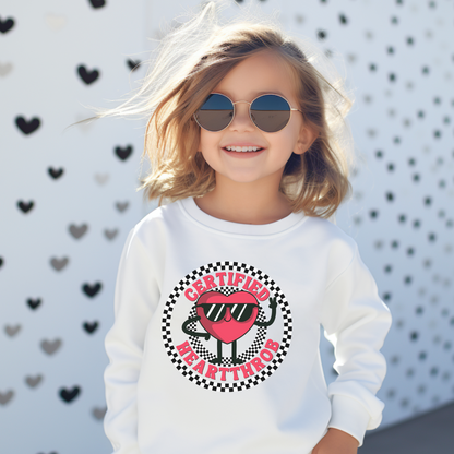 Image: Certified Heartthrob Sweatshirt for kids. This Valentines Day sweater for boys or girls is available in white or gray. It features a checker pattern ring, with a cartoon heart man wearing sunglasses, with the text Certified Heartthrob, by jaecrece