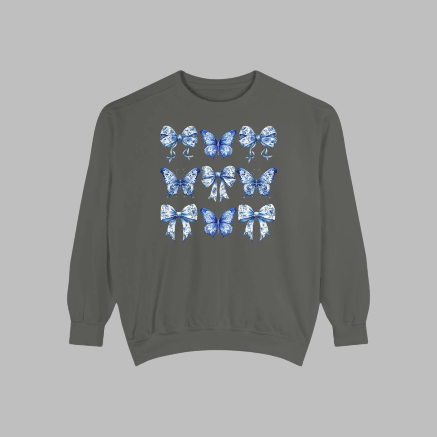 Image: Blue Toile Butterflies & Bows Women’s Sweatshirt, ideal for moms who want cozy spring fashion with a vintage feel. Features soft fabric, beautiful blue butterfly motifs, and ribbon details that give this sweatshirt its signature charm. Matches toddler and youth sizes for family photo looks or holiday celebrations, by jaecrece.