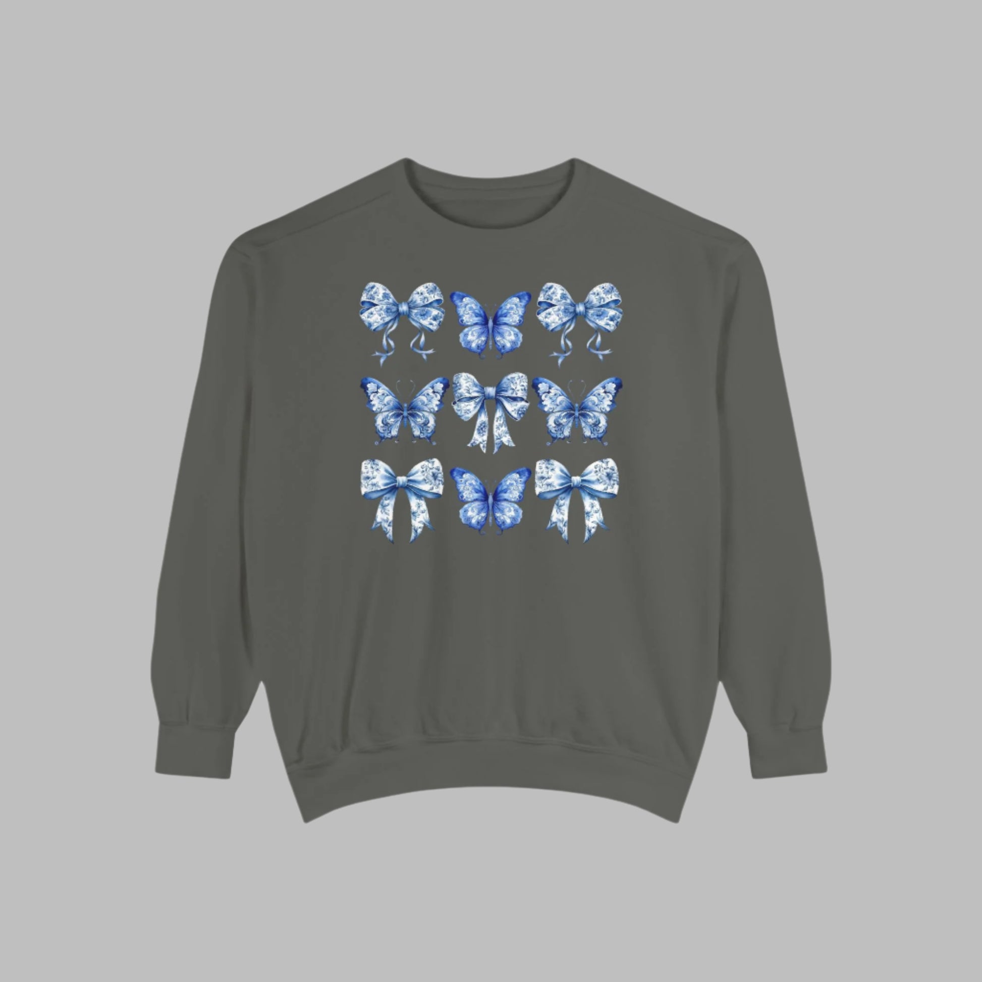 Image: Blue Toile Butterflies & Bows Women’s Sweatshirt, ideal for moms who want cozy spring fashion with a vintage feel. Features soft fabric, beautiful blue butterfly motifs, and ribbon details that give this sweatshirt its signature charm. Matches toddler and youth sizes for family photo looks or holiday celebrations, by jaecrece.