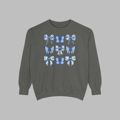 Image: Blue Toile Butterflies & Bows Women’s Sweatshirt, ideal for moms who want cozy spring fashion with a vintage feel. Features soft fabric, beautiful blue butterfly motifs, and ribbon details that give this sweatshirt its signature charm. Matches toddler and youth sizes for family photo looks or holiday celebrations, by jaecrece.