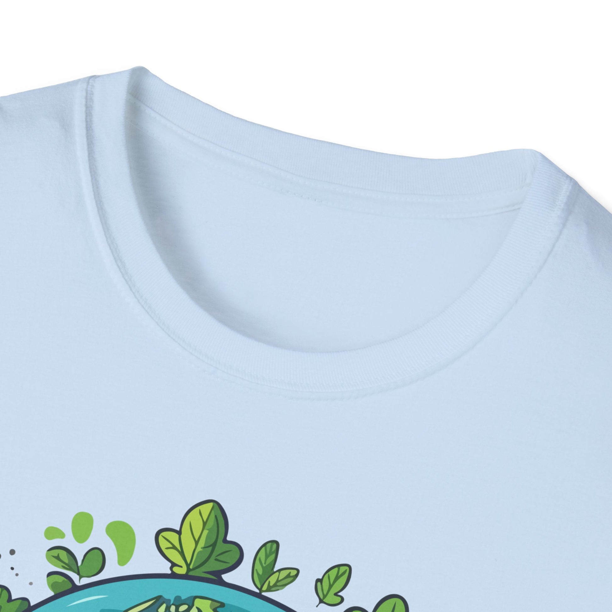 Close-up of a light blue crewneck t-shirt showing the collar and the top of a green and teal graphic print at the bottom.