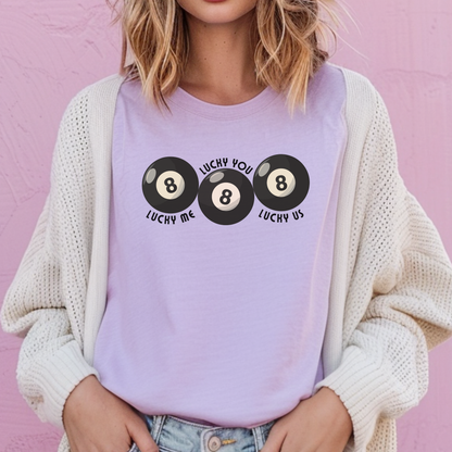 Unisex Comfort Colors Lucky Me Lucky You Lucky Us shirt in Ivory with bold black 8 ball artwork across the chest. Premium garment dyed cotton tee offers a relaxed silhouette and soft broken in texture. Great matching couples shirt for wedding photos, bridal showers, honeymoon trips, Valentine gifts, or celebrating how lucky are we moments. Trend driven graphic tee with vintage pool hall charm and modern everyday wearability.