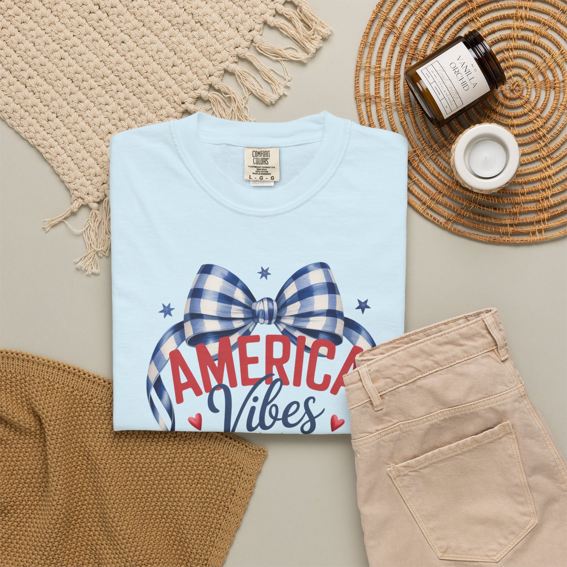 Comfort Colors patriotic strawberry shirt celebrating the 250th anniversary of the United States with hand drawn strawberry artwork stars and gingham bow details. Vintage Americana inspired garment dyed cotton tee with relaxed fit designed for women who love patriotic summer fashion. Ideal for 4th of July outfits mommy and me matching looks patriotic family photos backyard barbecues Labor Day weekends and casual Americana everyday wear