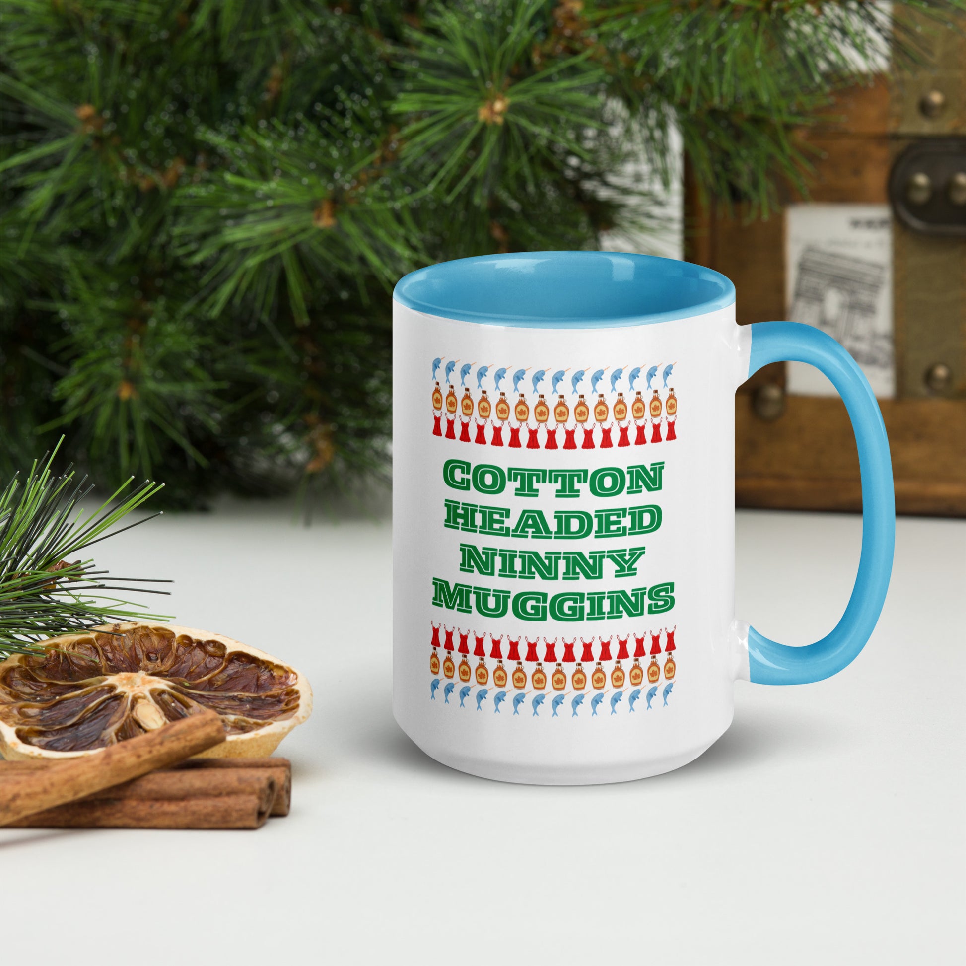 Large ceramic Christmas mug with “Cotton Headed Ninny Muggins” in bold print, designed for holiday fun and movie-inspired laughter. This 15 oz mug features a colorful interior and handle and is both microwave and dishwasher safe. Makes a funny Christmas gift, perfect for coffee lovers, holiday movie fans, or festive office parties.