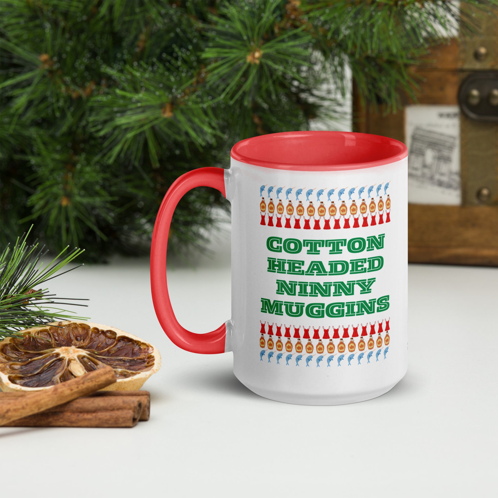 15 oz Elf quote mug with colorful accents and “Cotton Headed Ninny Muggins” printed on front. This holiday mug is a fun, festive way to enjoy cocoa or coffee during the Christmas season. Crafted from ceramic, safe for microwave and dishwasher use. Great for gifting, stocking stuffers, or cozy winter mornings with your favorite Christmas movie.