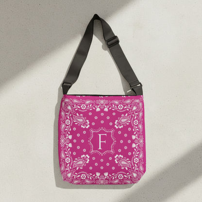 Custom hot pink western tote bag personalized with your initials and inspired by traditional bandana prints. Durable polyester construction with an adjustable strap, roomy interior, and inside pocket makes it perfect for errands, vacations, school, or weekend adventures.