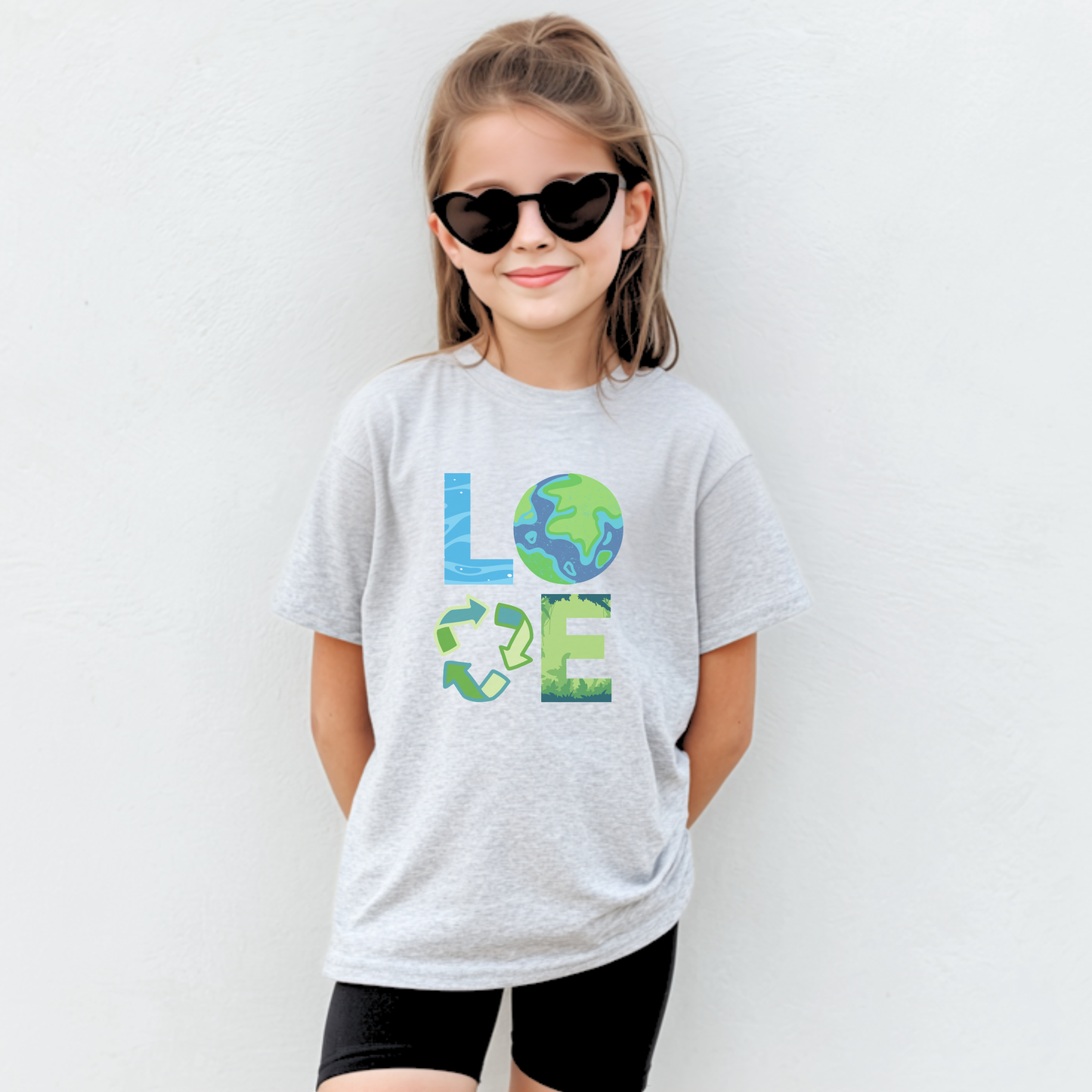 Cute kids Earth Day shirt featuring eco themed artwork celebrating Earth Day April 22 and promoting green living reduce reuse recycle and sustainable earth friendly habits. Youth unisex tee in sizes XS to XL in White Ash Heather Navy and Forest Green. Perfect for school Earth Day outfits classroom celebrations and mommy and me matching clothing sets. Soft comfortable everyday tee for nature loving kids.