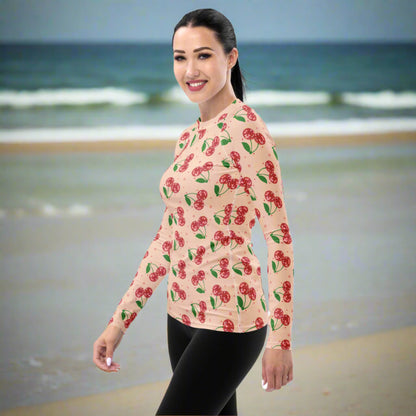 Disco cherry women’s swim top featuring a vibrant fruit inspired design, long sleeve coverage, and flexible performance fabric for swimming, surfing, paddleboarding, boating, and outdoor adventures.