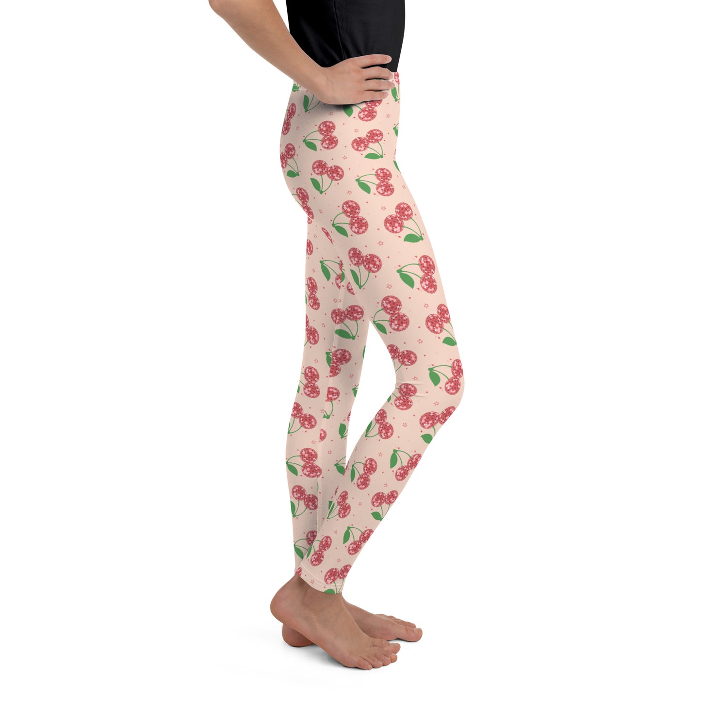 These made to order Disco Cherries Youth Girls Leggings are the ultimate mix of comfort, color, and retro charm. The pink cherry print adds a playful vintage vibe, while the soft microfiber fabric and four way stretch make them perfect for dance, school, or lounging. Each pair is precision cut and hand sewn for lasting quality. Ideal for tweens who love unique outfits, bright prints, and cozy leggings that move with them all day.