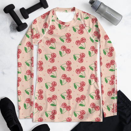 Women’s UPF 50+ swim rash guard with a bold disco cherries pattern, long sleeves, and comfortable stretch fabric, combining fun retro fashion with practical sun protection for beach and outdoor activities.