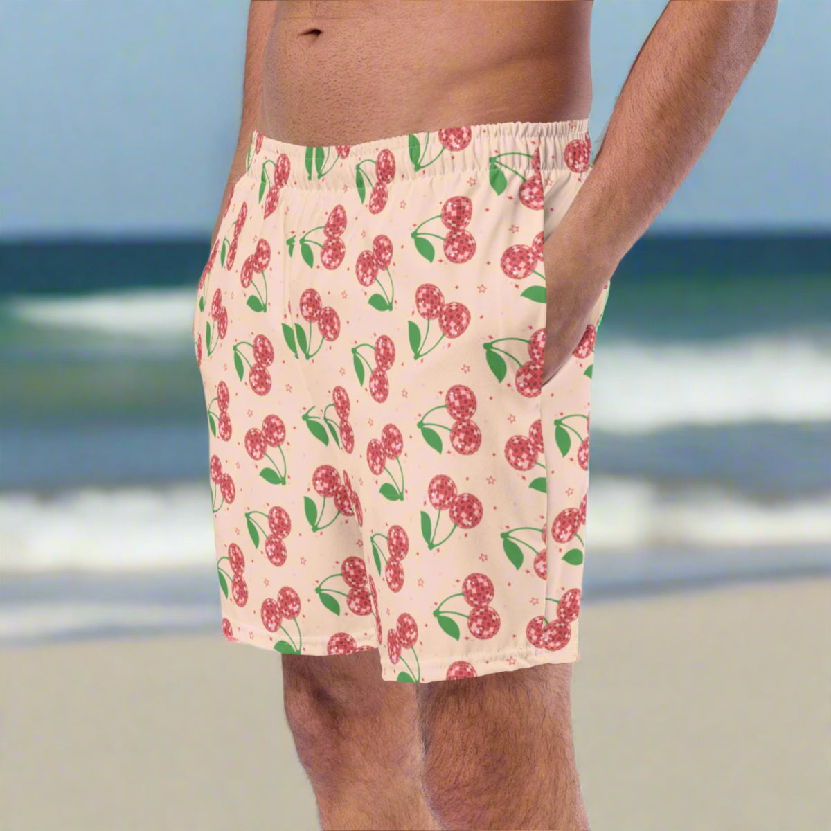 Disco cherries men’s swim boxers in sizes 2XS through 6XL, including regular and plus sizes. These pink swim shorts feature red disco ball cherries and stars in a playful retro fruit print, perfect for beach vacations, pool days, cruises, and family matching swimwear by JaeCrece.