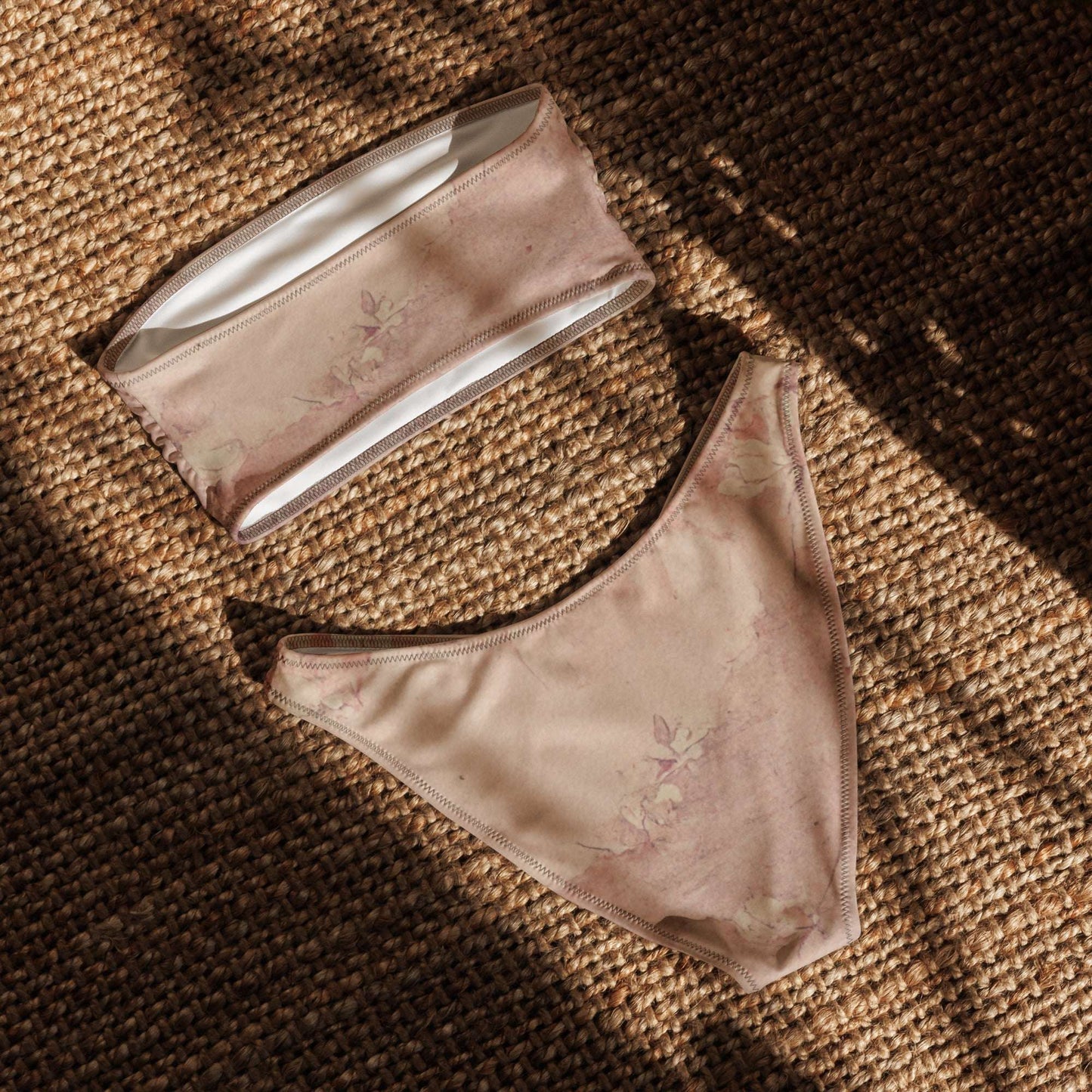Back flat lay of the Dusty Pink Bandeau Bikini, highlighting the seamless construction and high-cut leg bottoms. This eco-conscious two-piece is made from recycled polyester and LYCRA® for comfort and flexibility. A perfect gift for her or a must-have for cottagecore fashion lovers, this strapless swimsuit flatters every figure and offers UPF 50+ protection in sizes 2XS to 6XL.